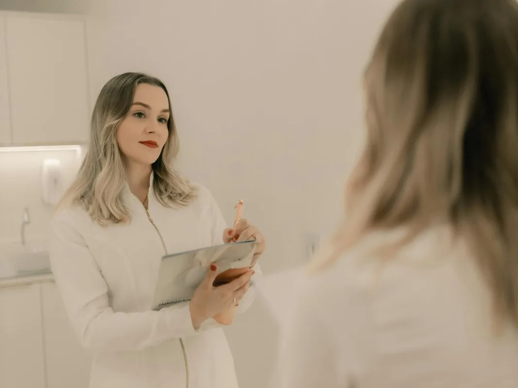 Healthcare clinician with patient